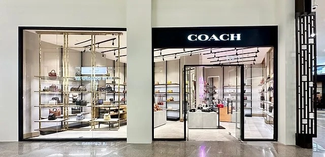 coach outlet wallet materials comparison